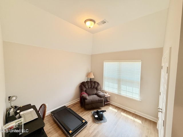 3020 Makenlee St, Southaven, MS 38672 - exercise room featuring wood finished floors, baseboards, and vaulted ceiling