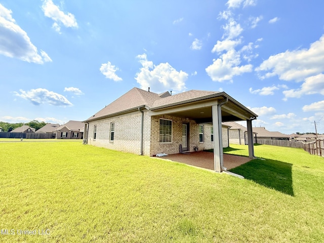 3020 Makenlee St, Southaven, MS 38672 - rear view of property featuring brick siding, a patio, and a shingled roof
