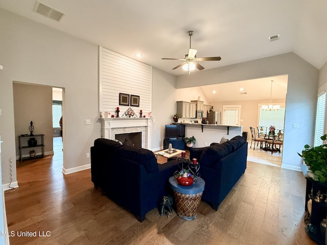 3020 Makenlee St, Southaven, MS 38672 - living area with wood finished floors, ceiling fan, lofted ceiling, a chandelier, and baseboards