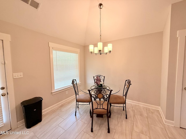 3020 Makenlee St, Southaven, MS 38672 - dining room with a chandelier, baseboards, and lofted ceiling