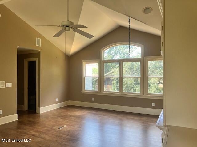 unfurnished living room featuring ceiling fan, vaulted ceiling, and dark hardwood / wood-style flooring