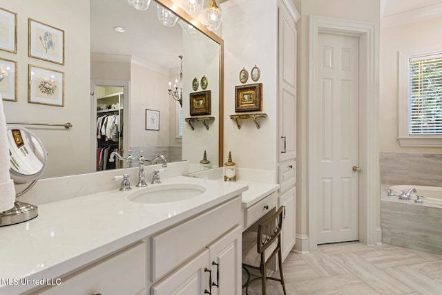 bathroom featuring vanity, crown molding, a relaxing tiled tub, and a chandelier