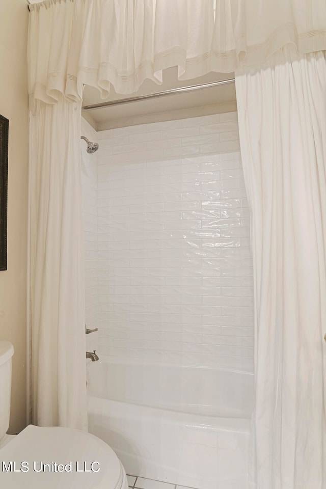 bathroom with toilet and shower / bathtub combination with curtain