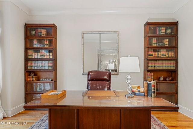 office with light hardwood / wood-style flooring