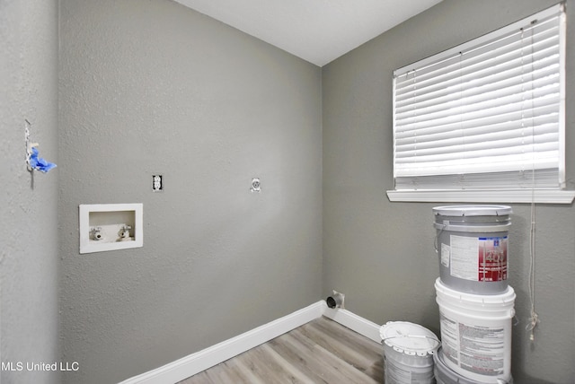 washroom featuring laundry area, baseboards, hookup for a washing machine, light wood-style floors, and electric dryer hookup