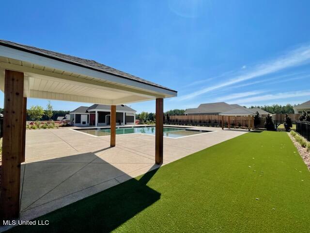 view of swimming pool with a patio