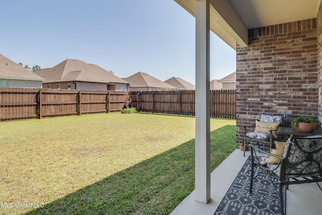 view of yard with a fenced backyard
