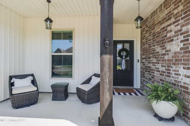 view of exterior entry featuring a porch