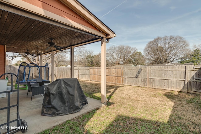 view of yard featuring a patio and ceiling fan