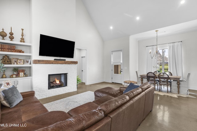 212 Ashbury Cv, Canton, MS 39046 - living room featuring an inviting chandelier, finished concrete flooring, a fireplace, high vaulted ceiling, and recessed lighting