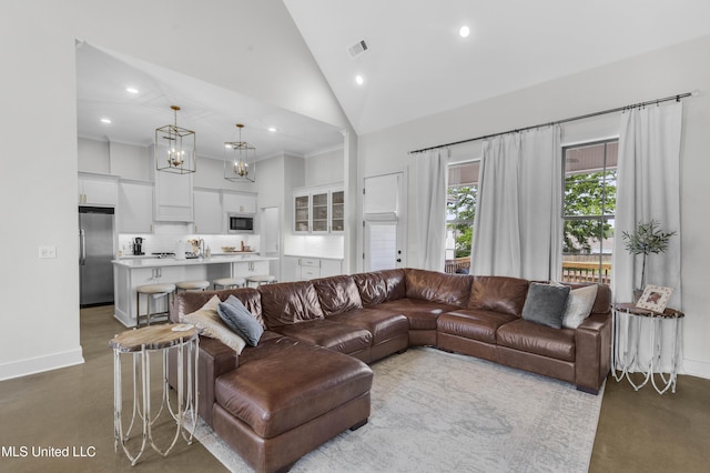 212 Ashbury Cv, Canton, MS 39046 - living room with recessed lighting, baseboards, high vaulted ceiling, and visible vents