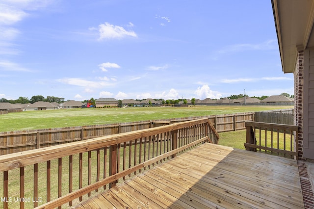 212 Ashbury Cv, Canton, MS 39046 - wooden terrace with a lawn, a residential view, and a fenced backyard