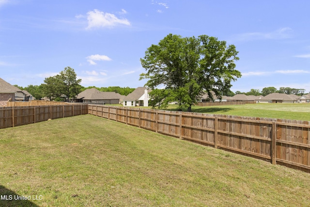 212 Ashbury Cv, Canton, MS 39046 - view of yard with a fenced backyard and a residential view