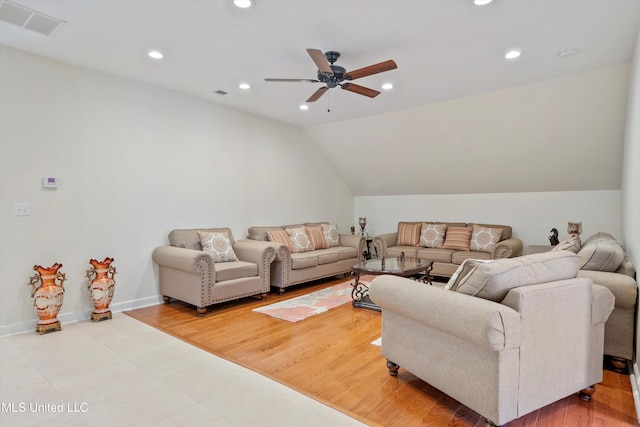 living room featuring lofted ceiling, light wood-type flooring, and ceiling fan