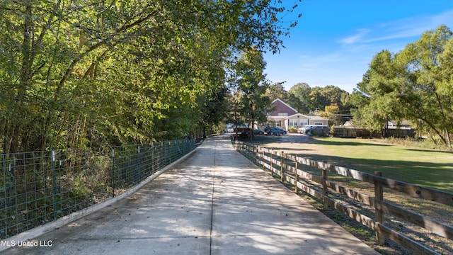 view of property's community featuring a yard