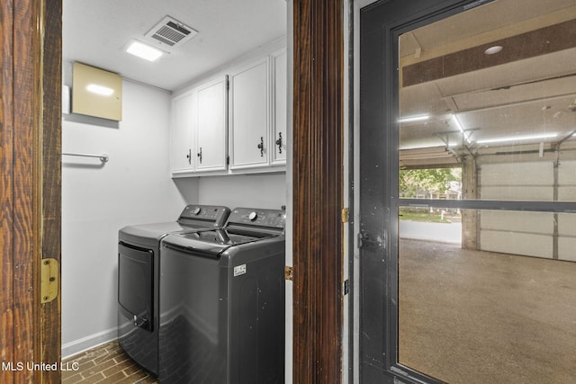 316 Meadow Creek Pl, Jackson, MS 39211 - washroom with cabinet space, independent washer and dryer, baseboards, and brick patterned floors