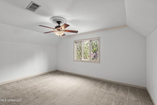 316 Meadow Creek Pl, Jackson, MS 39211 - additional living space with vaulted ceiling, carpet floors, ceiling fan, baseboards, and a textured ceiling
