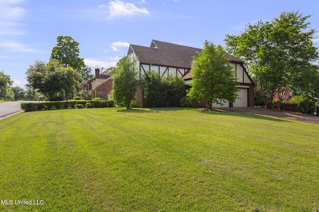 316 Meadow Creek Pl, Jackson, MS 39211 - view of grassy yard with an attached garage