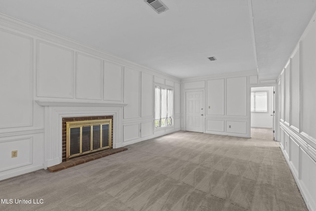 316 Meadow Creek Pl, Jackson, MS 39211 - unfurnished living room featuring a decorative wall, light colored carpet, and a fireplace