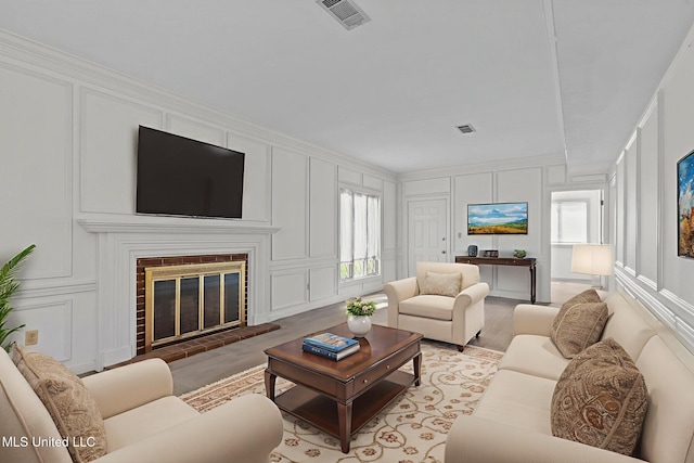 316 Meadow Creek Pl, Jackson, MS 39211 - living room featuring a decorative wall and a fireplace