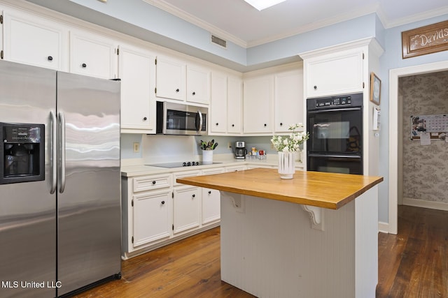 39 Moss Forest Cir, Jackson, MS 39211 - kitchen featuring dark wood-style floors, butcher block countertops, black appliances, visible vents, and white cabinets