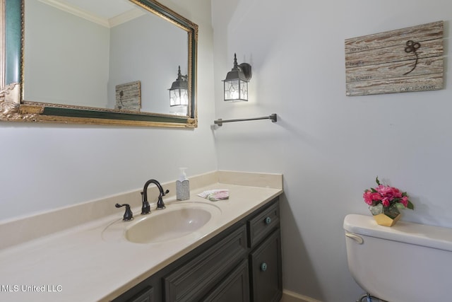 39 Moss Forest Cir, Jackson, MS 39211 - half bathroom featuring ornamental molding, toilet, and vanity