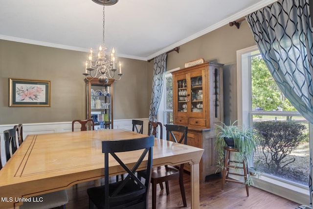 39 Moss Forest Cir, Jackson, MS 39211 - dining room featuring ornamental molding, a wainscoted wall, an inviting chandelier, and wood finished floors