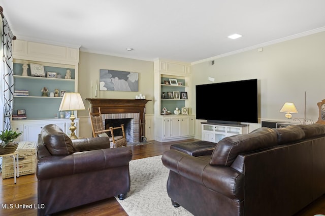 39 Moss Forest Cir, Jackson, MS 39211 - living room featuring a brick fireplace, wood finished floors, ornamental molding, and built in shelves