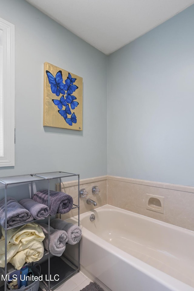 39 Moss Forest Cir, Jackson, MS 39211 - full bathroom with a garden tub and tile patterned flooring