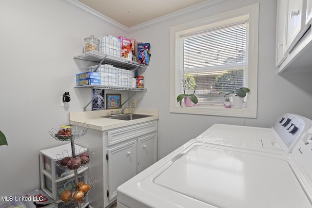 39 Moss Forest Cir, Jackson, MS 39211 - laundry area featuring independent washer and dryer, cabinet space, crown molding, and a sink