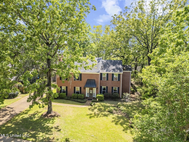 39 Moss Forest Cir, Jackson, MS 39211 - colonial home featuring a front lawn and brick siding