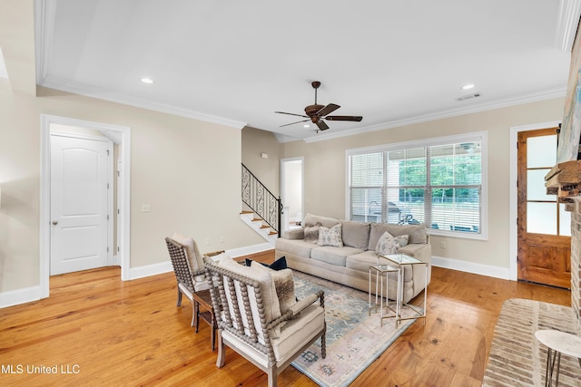 413 Miles Cv, Brandon, MS 39047 - living area with ceiling fan, stairs, light wood finished floors, crown molding, and baseboards