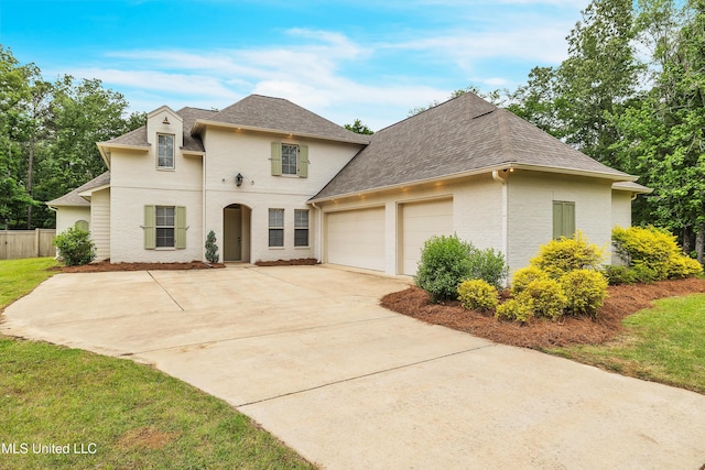 413 Miles Cv, Brandon, MS 39047 - view of front of home featuring an attached garage, driveway, and a shingled roof
