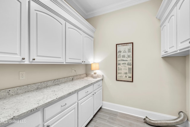 413 Miles Cv, Brandon, MS 39047 - washroom with cabinet space, crown molding, and baseboards