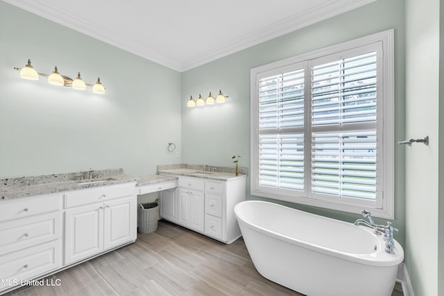 413 Miles Cv, Brandon, MS 39047 - bathroom with vanity, a soaking tub, plenty of natural light, and ornamental molding