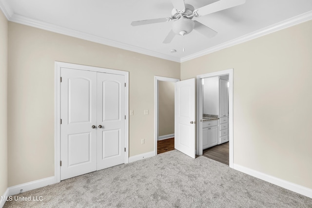 413 Miles Cv, Brandon, MS 39047 - unfurnished bedroom with carpet flooring, crown molding, baseboards, a closet, and a ceiling fan