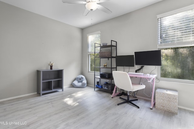 office space with baseboards, a ceiling fan, and wood finished floors