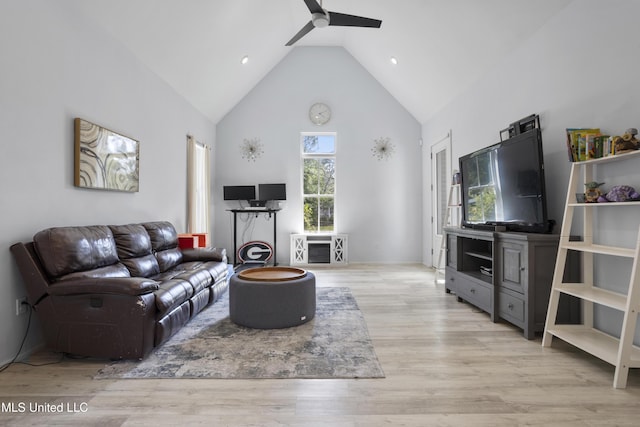 living area with high vaulted ceiling, a ceiling fan, recessed lighting, and wood finished floors