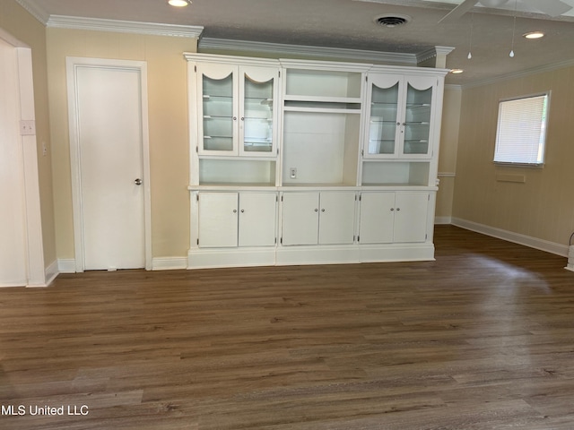 interior space with crown molding and dark hardwood / wood-style floors