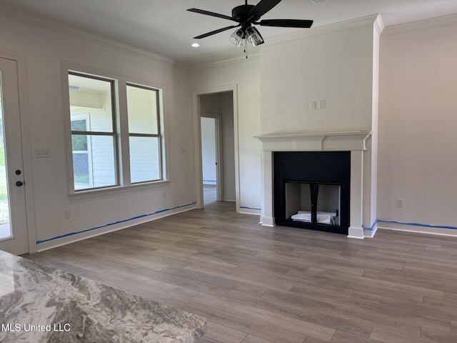 6 Hedges Plantation Pl, Natchez, MS 39120 - unfurnished living room with crown molding, ceiling fan, wood finished floors, a glass covered fireplace, and baseboards