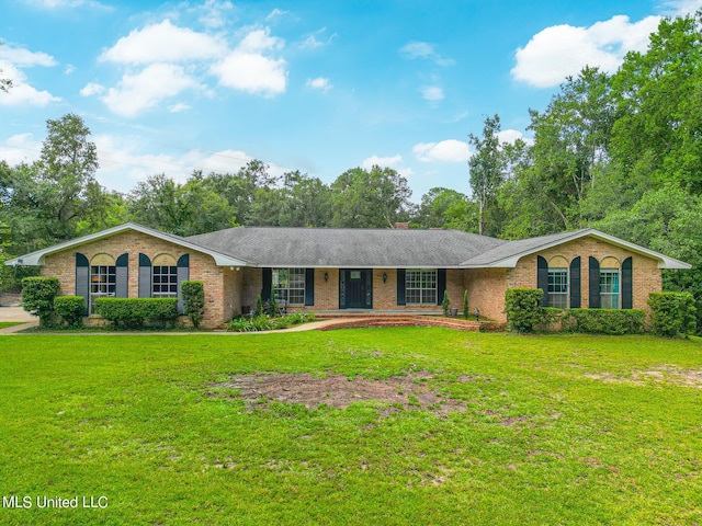 ranch-style home featuring a front yard