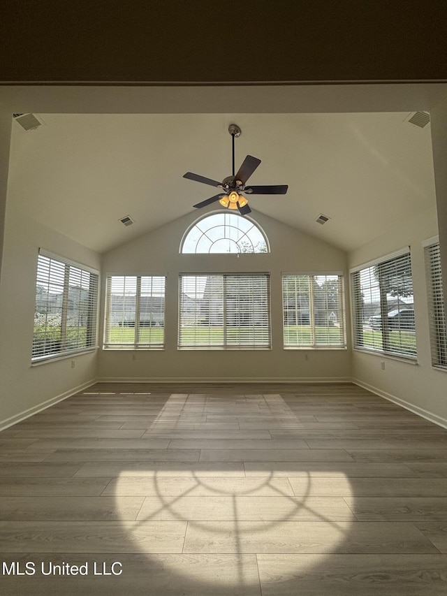 8911 Oak Branch Ln, Olive Branch, MS 38654 - unfurnished sunroom with wood finished floors, plenty of natural light, baseboards, and lofted ceiling