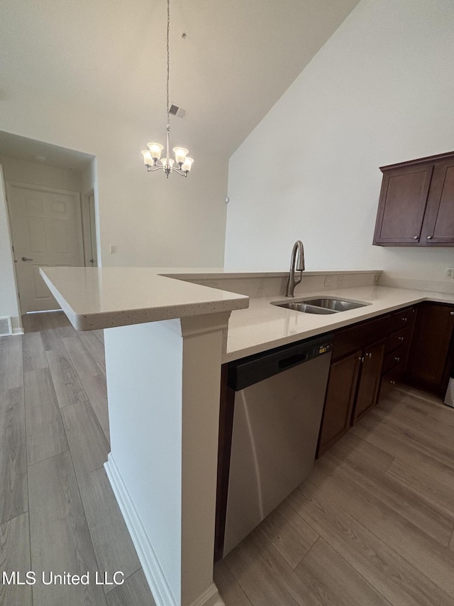 8911 Oak Branch Ln, Olive Branch, MS 38654 - kitchen featuring stainless steel dishwasher, a sink, light wood-style flooring, dark brown cabinets, and lofted ceiling