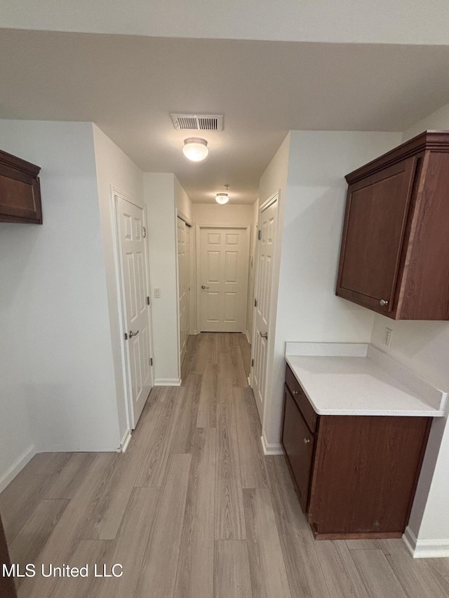 8911 Oak Branch Ln, Olive Branch, MS 38654 - hallway with light wood-style flooring and baseboards