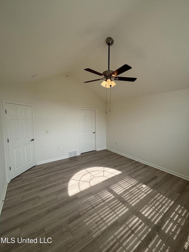 8911 Oak Branch Ln, Olive Branch, MS 38654 - spare room featuring wood finished floors, baseboards, ceiling fan, and vaulted ceiling