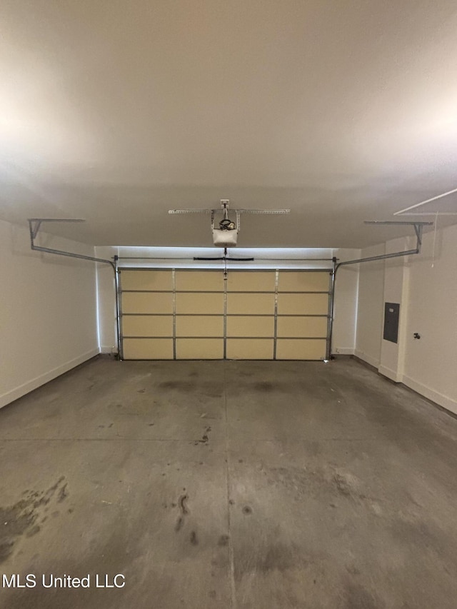 8911 Oak Branch Ln, Olive Branch, MS 38654 - garage with a garage door opener and baseboards