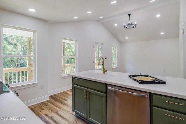11014 Gannet St, Bay Saint Louis, MS 39520 - kitchen featuring dishwasher, a sink, plenty of natural light, light countertops, and vaulted ceiling