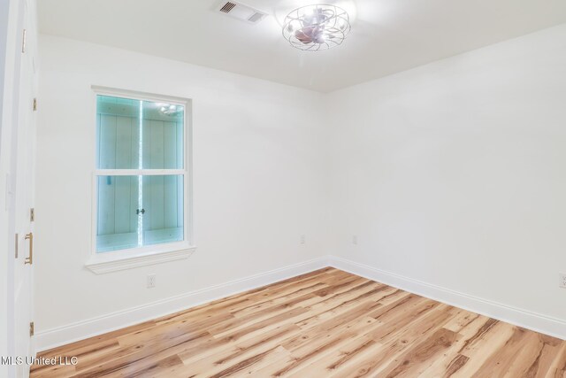 11014 Gannet St, Bay Saint Louis, MS 39520 - unfurnished room featuring wood finished floors and baseboards