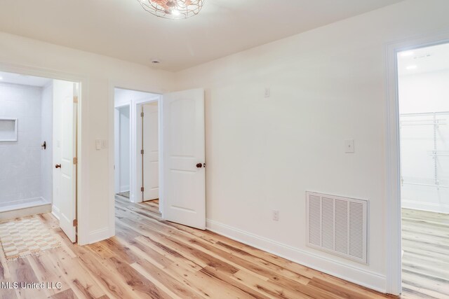 11014 Gannet St, Bay Saint Louis, MS 39520 - spare room featuring light wood finished floors and baseboards
