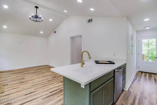 11014 Gannet St, Bay Saint Louis, MS 39520 - kitchen with green cabinetry, a sink, light wood finished floors, baseboards, and a chandelier